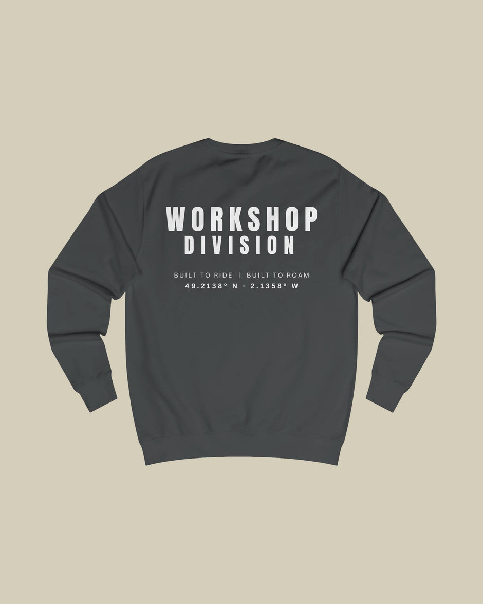 Dark gray sweatshirt with 'Workshop Division' text on the back against a beige background