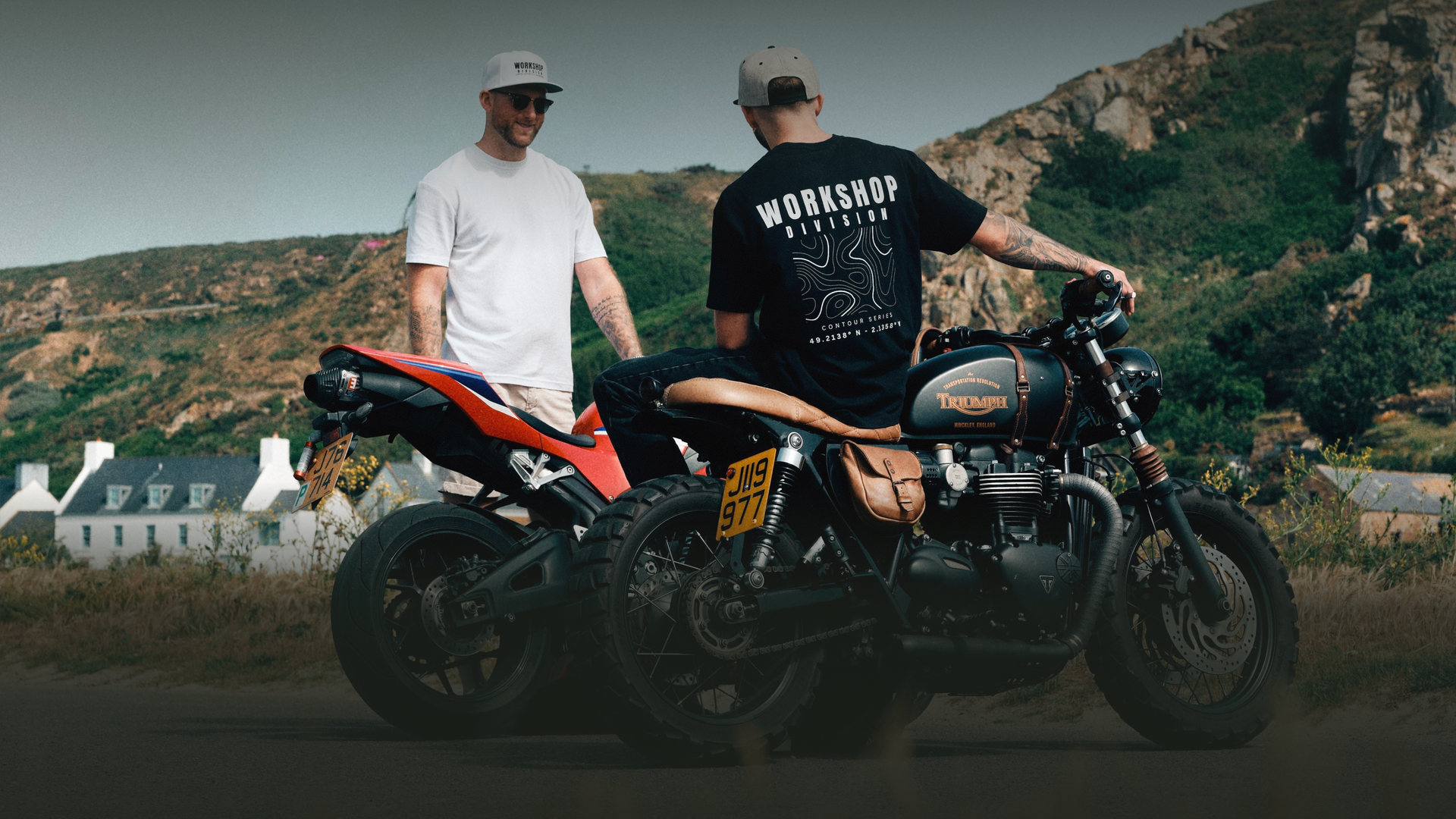 Two men with motorcycles in a scenic outdoor setting
