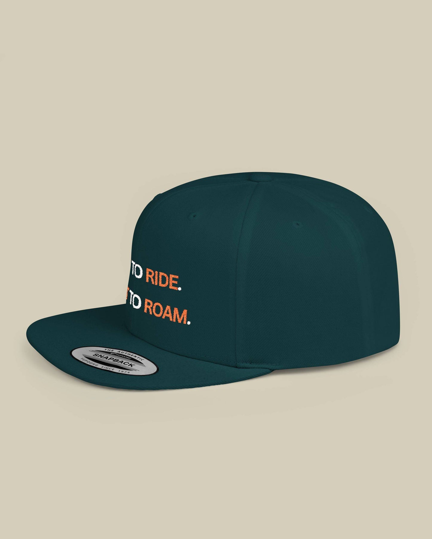 Green cap with 'Ride' and 'Roam' text on a beige background