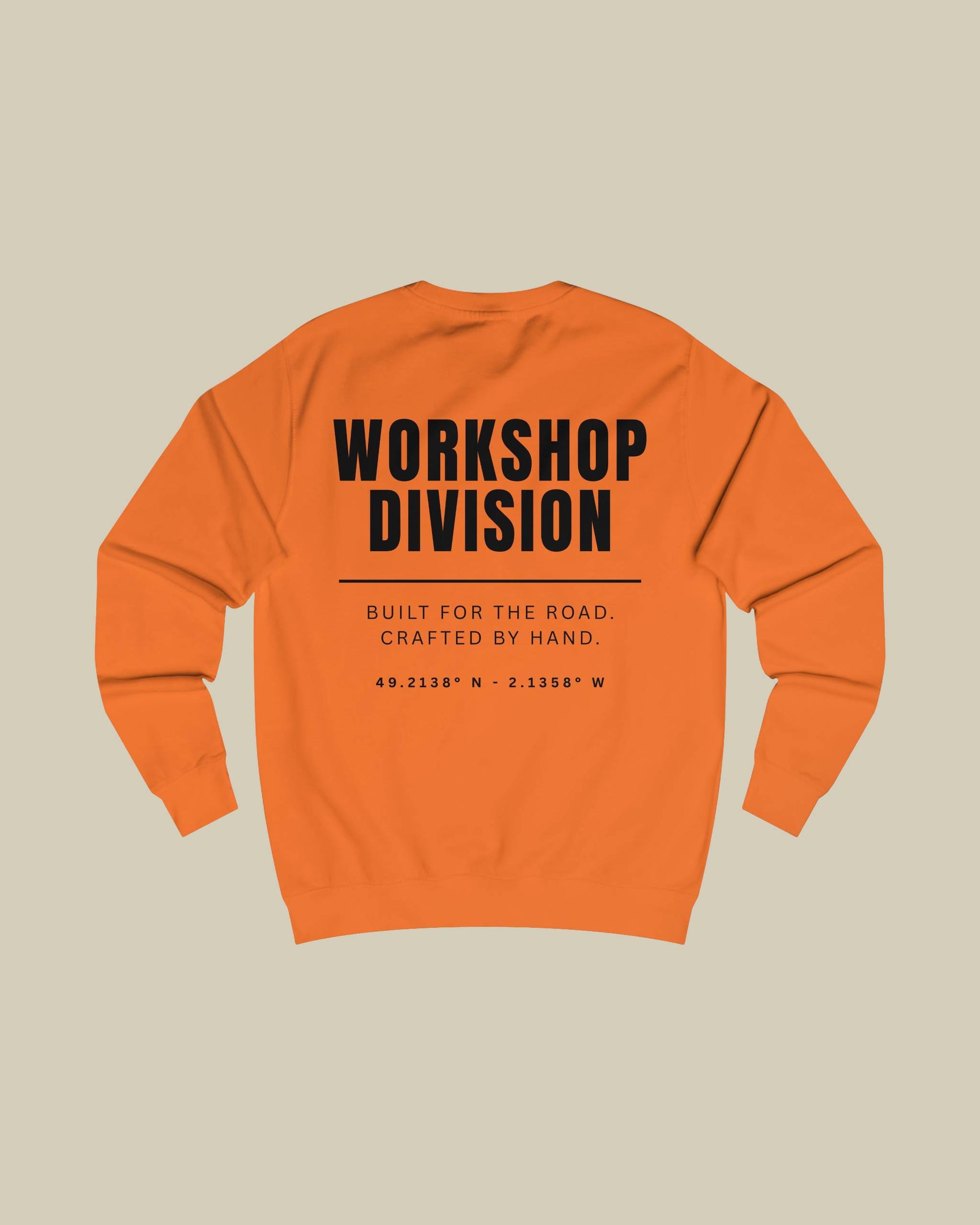 Orange sweatshirt with 'Workshop Division' text on a beige background
