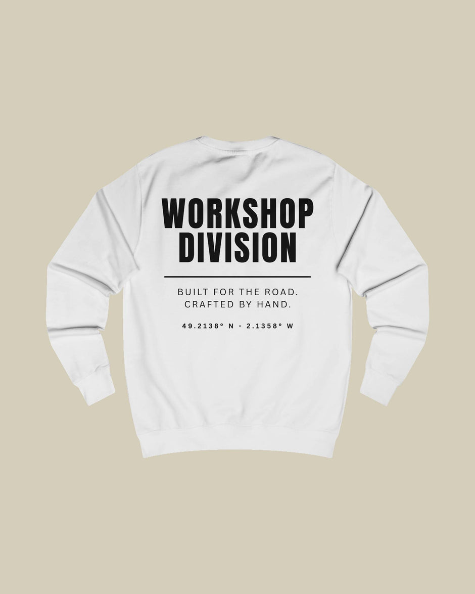 White sweatshirt with 'Workshop Division' text on a beige background