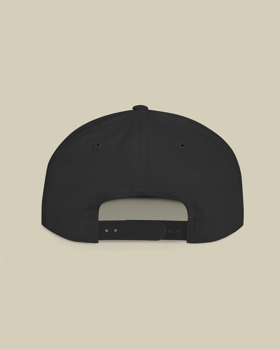 Black cap on a beige background