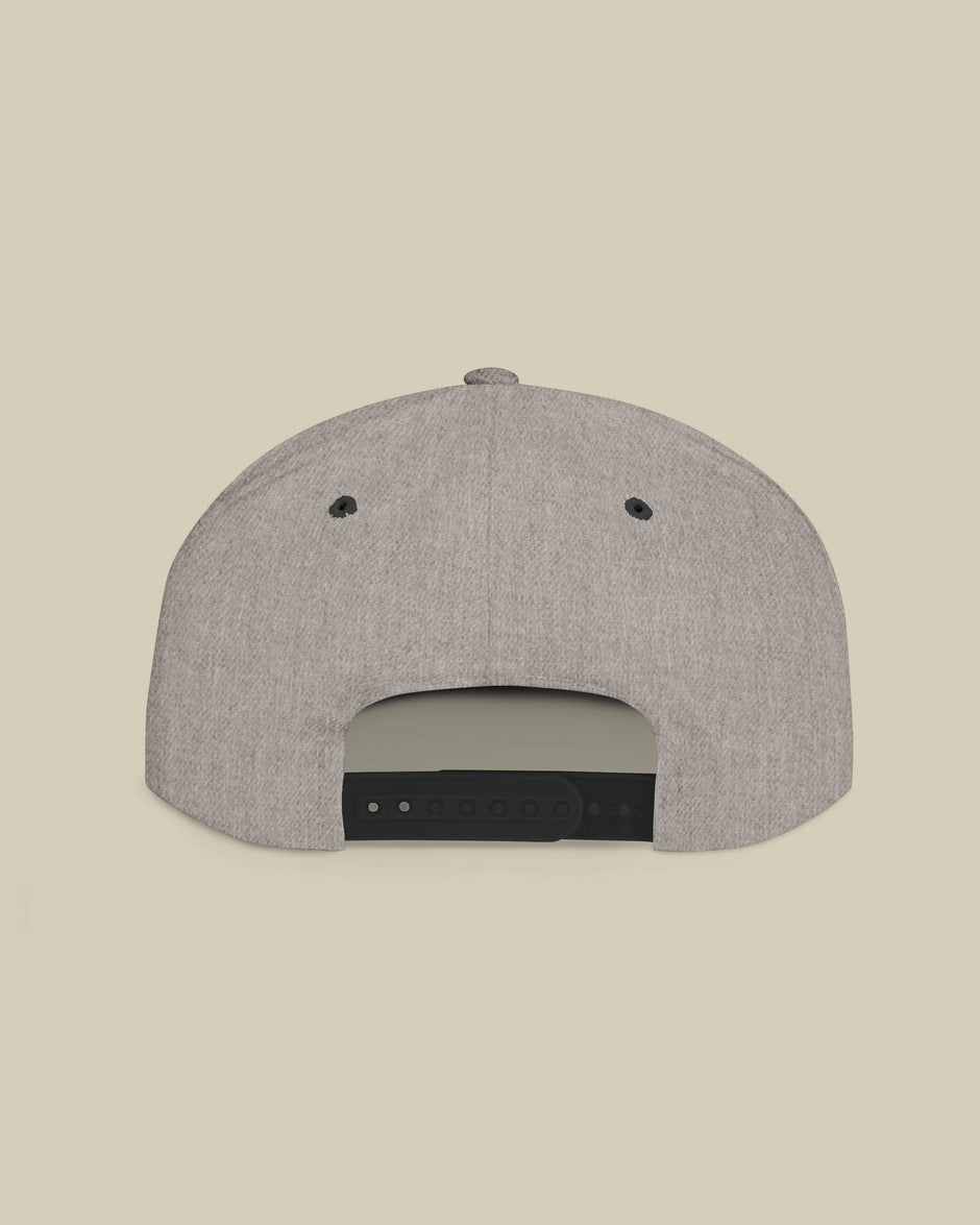 Gray cap with black brim on a beige background