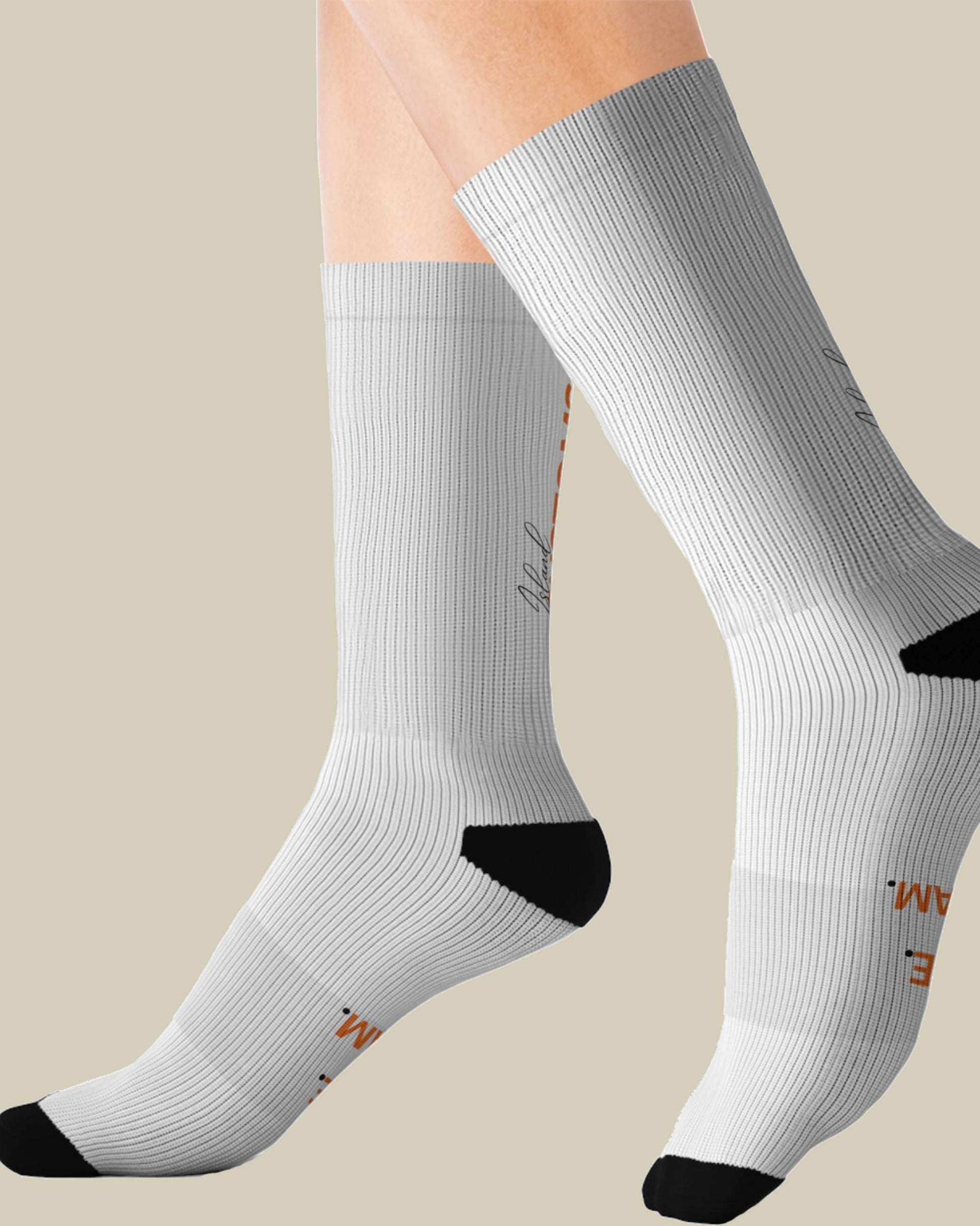 White socks with black toes and heels on a beige background