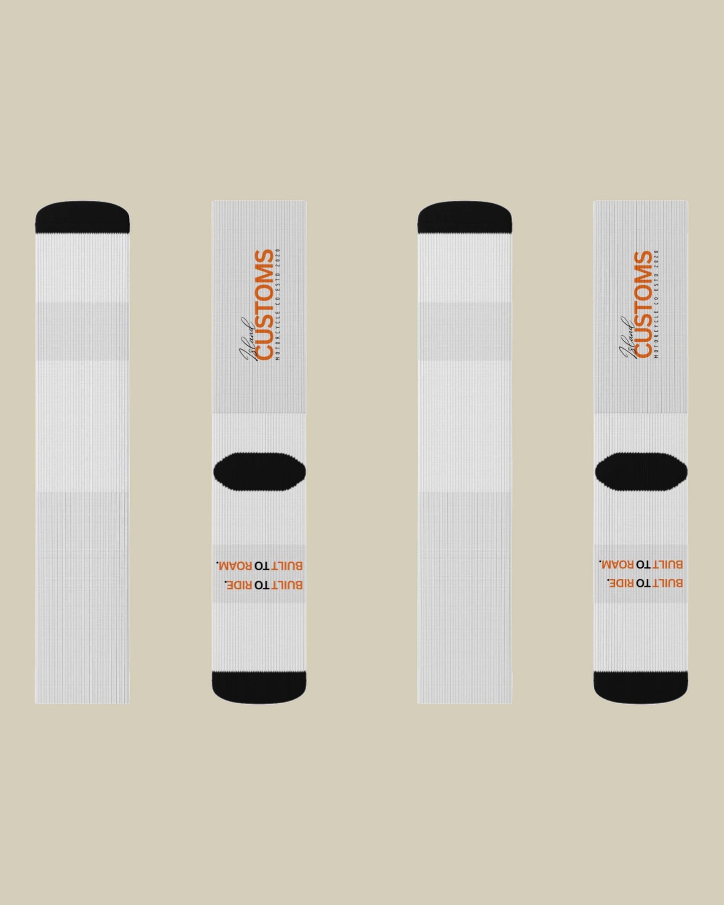 Four white socks with black toes and heels on a beige background, featuring 'Customs' branding.