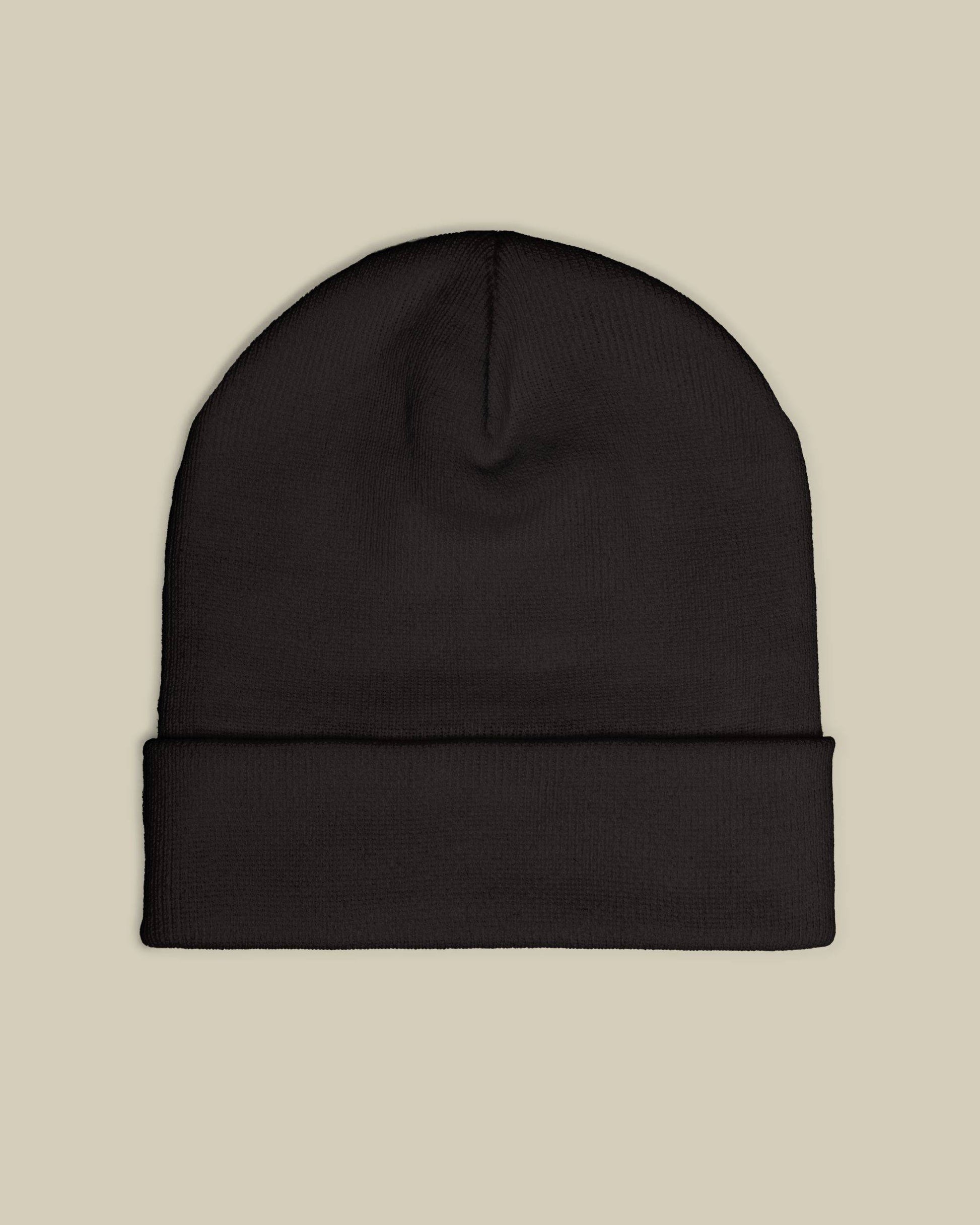 Black beanie on a beige background
