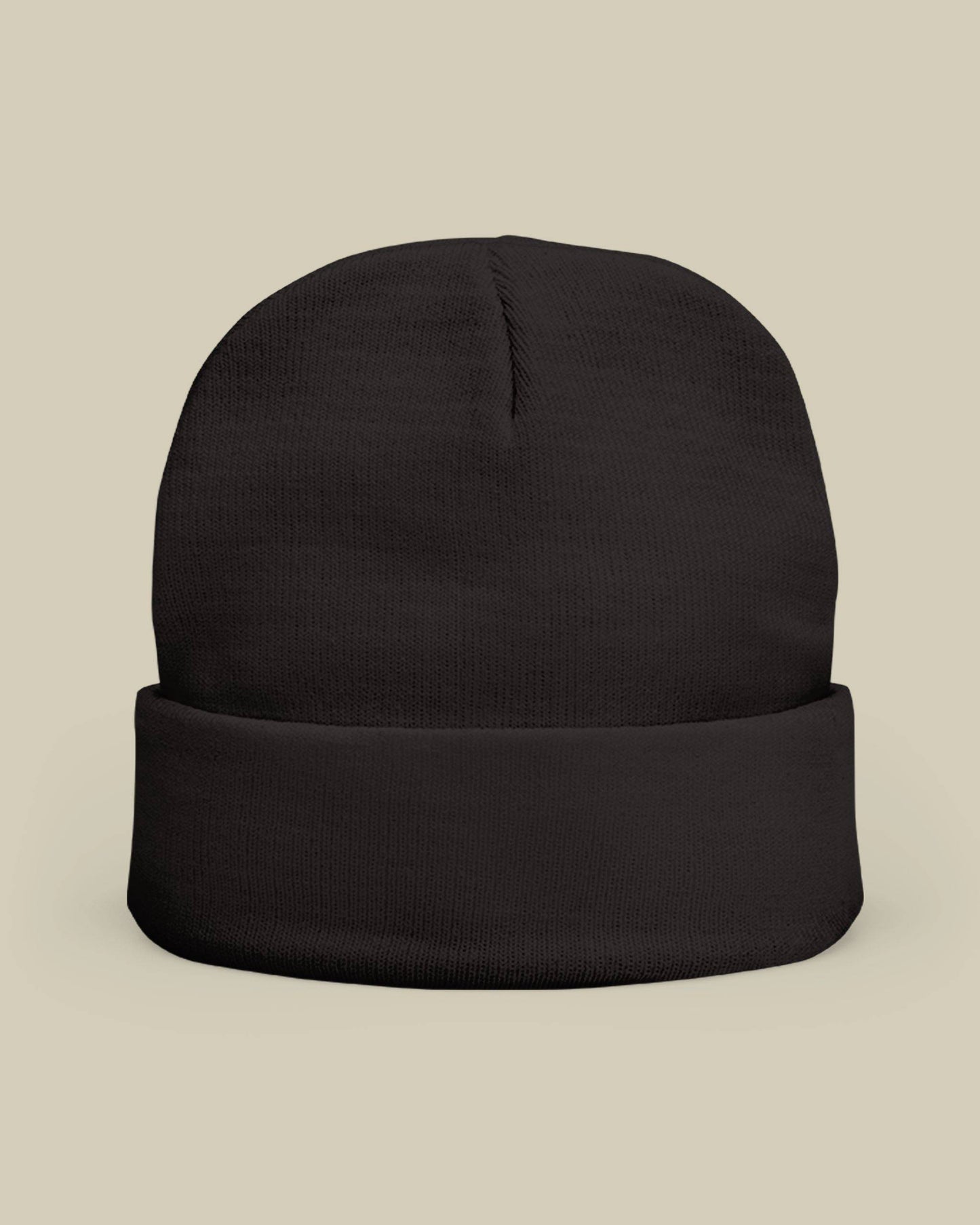 Black beanie on a beige background