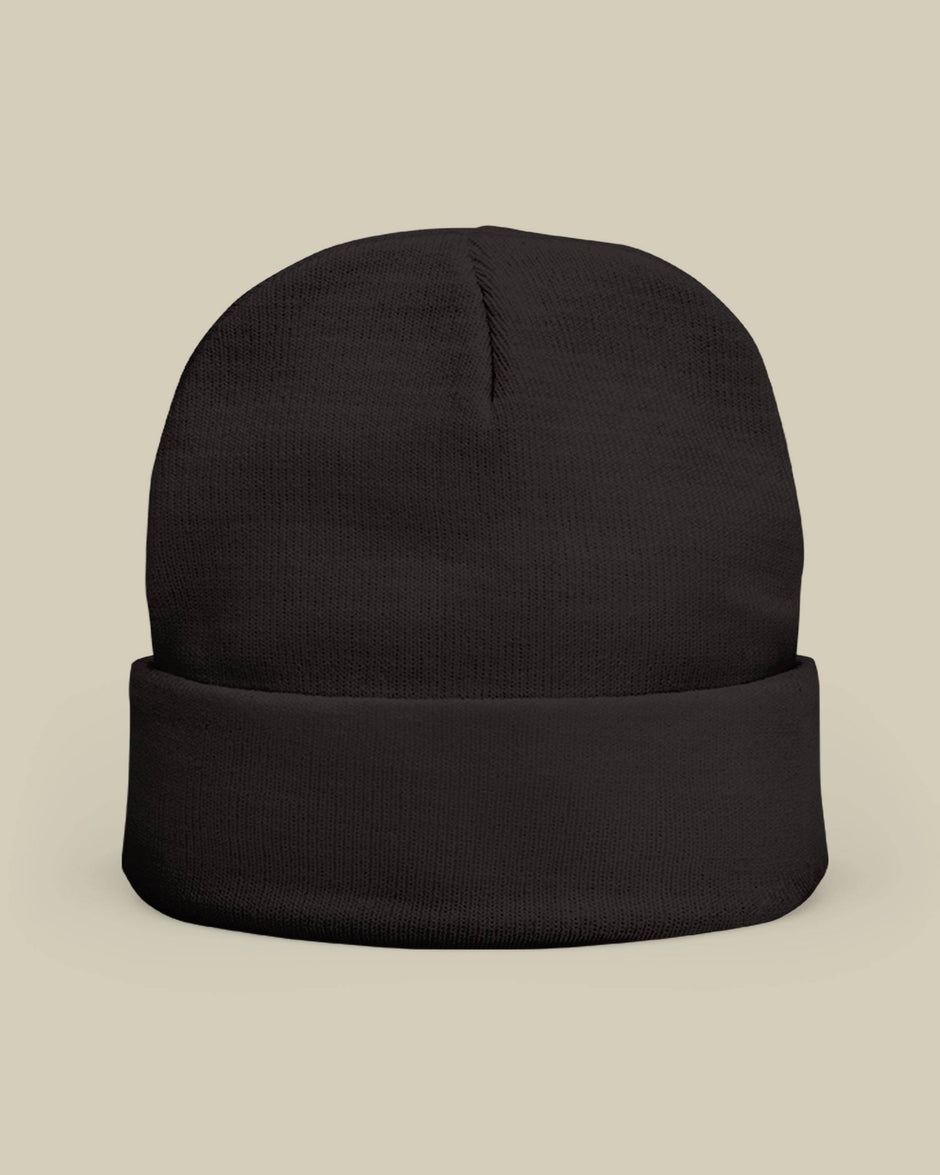 Black beanie on a beige background