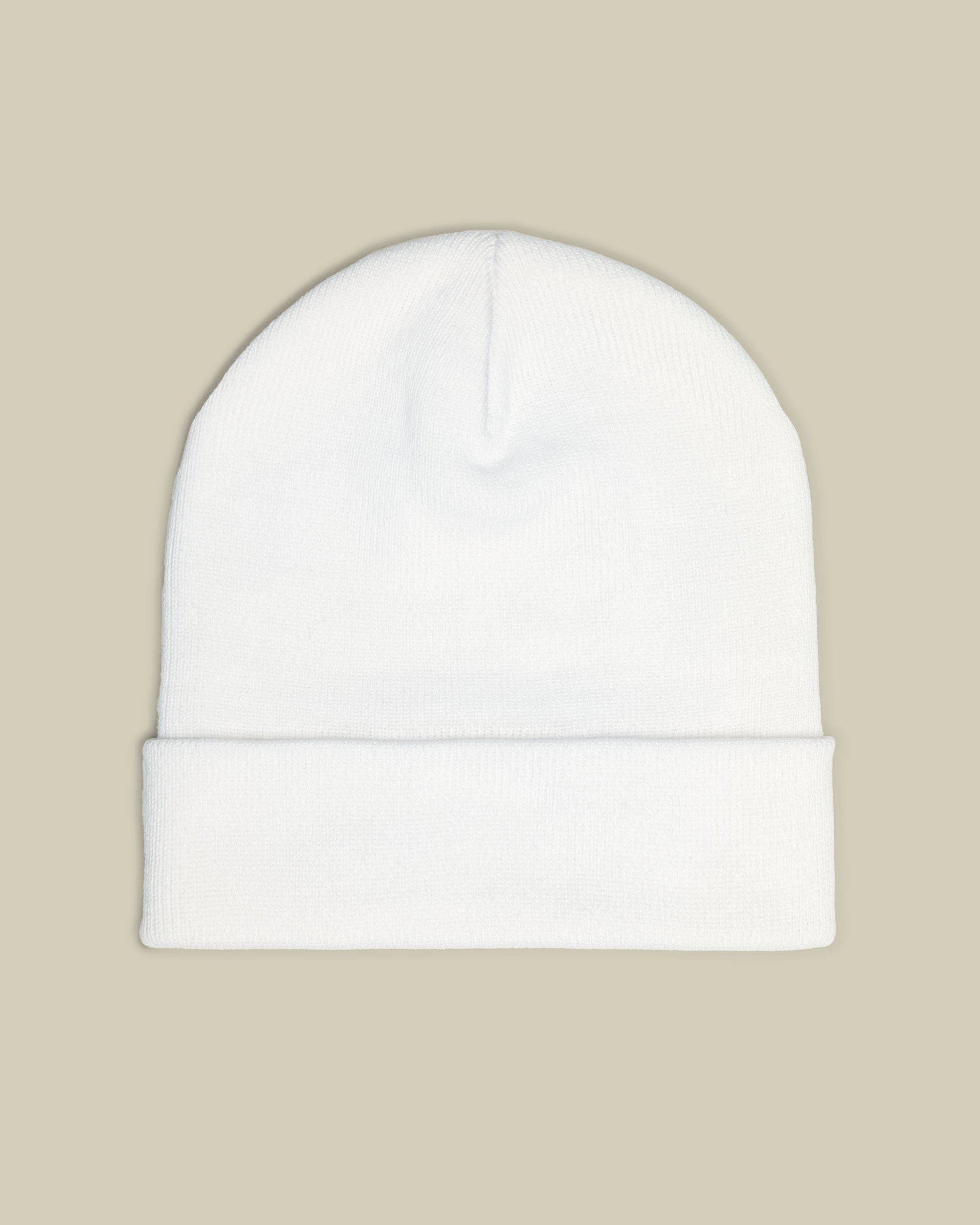 White beanie on a beige background