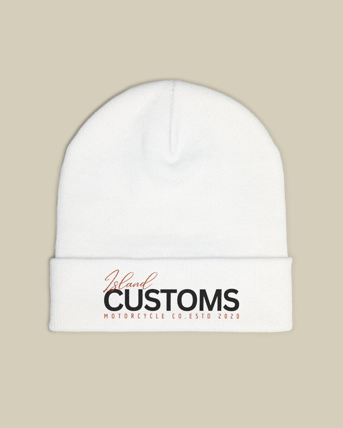 White beanie with 'Customs' logo on a beige background