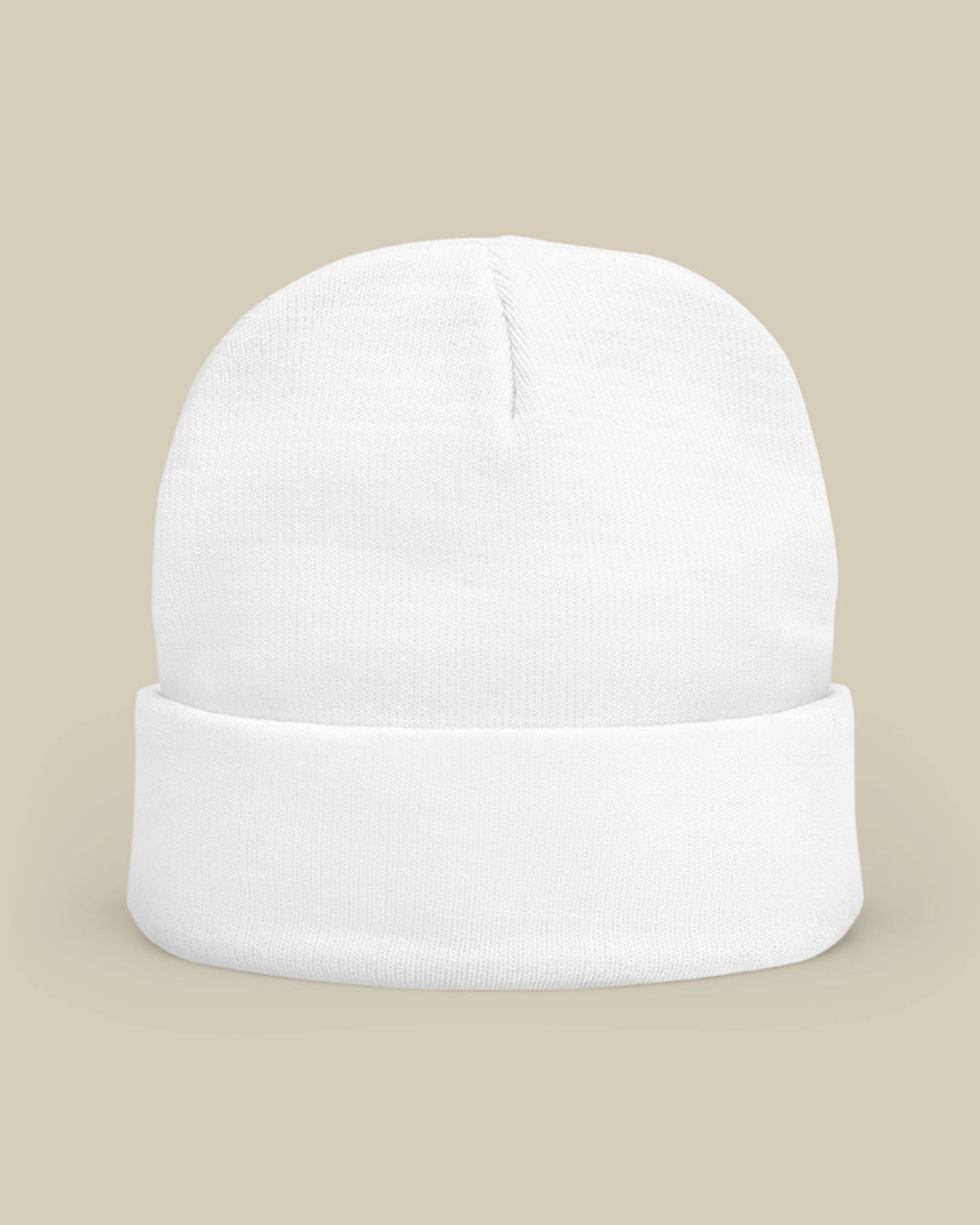 White beanie on a beige background