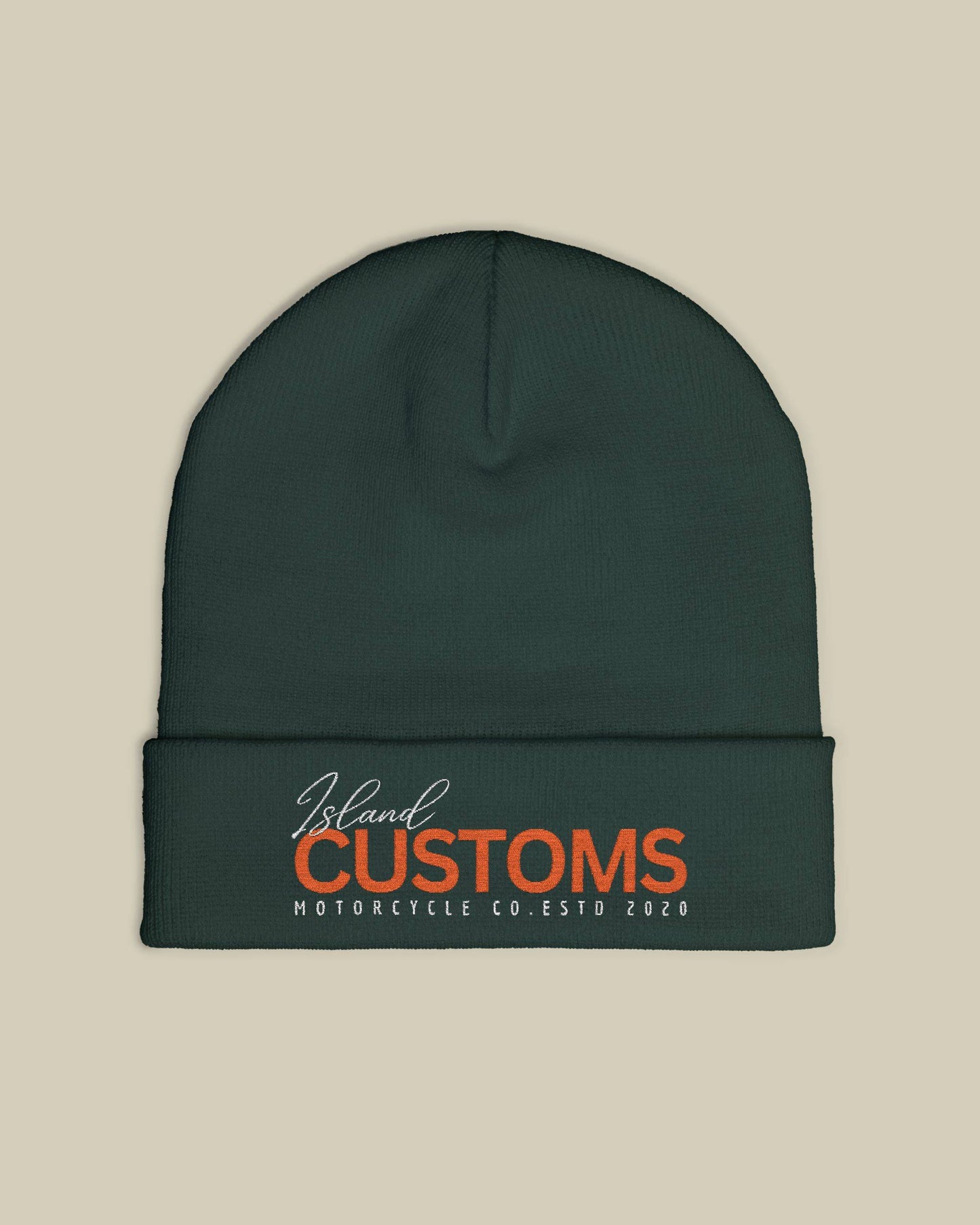 Dark green beanie with 'Island Customs' logo on a beige background