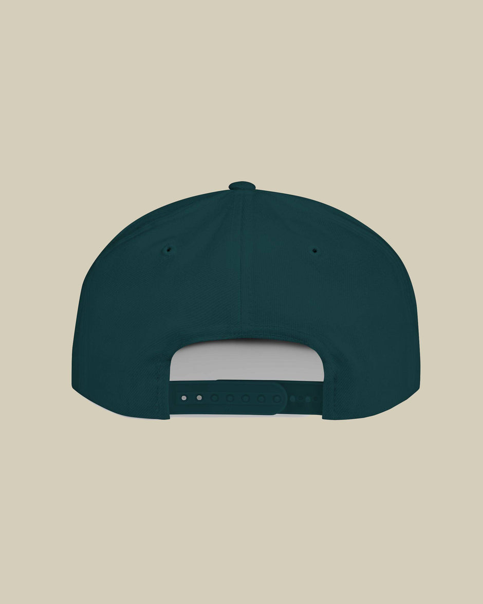 Dark green cap on a beige background