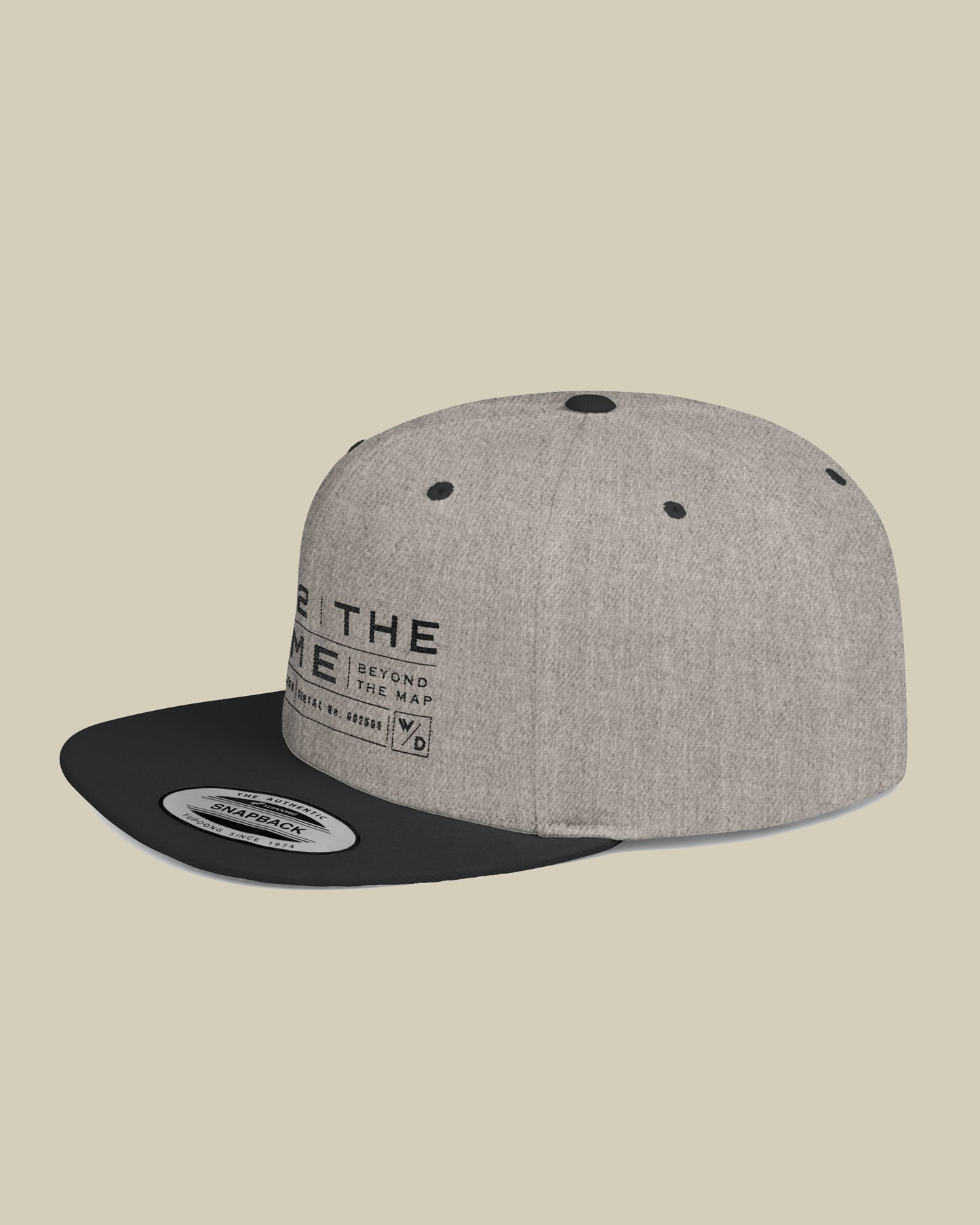 Gray and black cap with text on a beige background