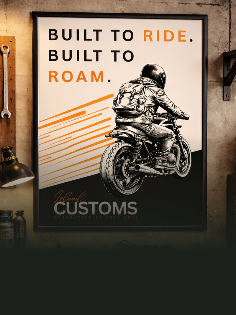 Poster with a motorcycle graphic and text 'Built to Ride, Built to Roam' on a wall.
