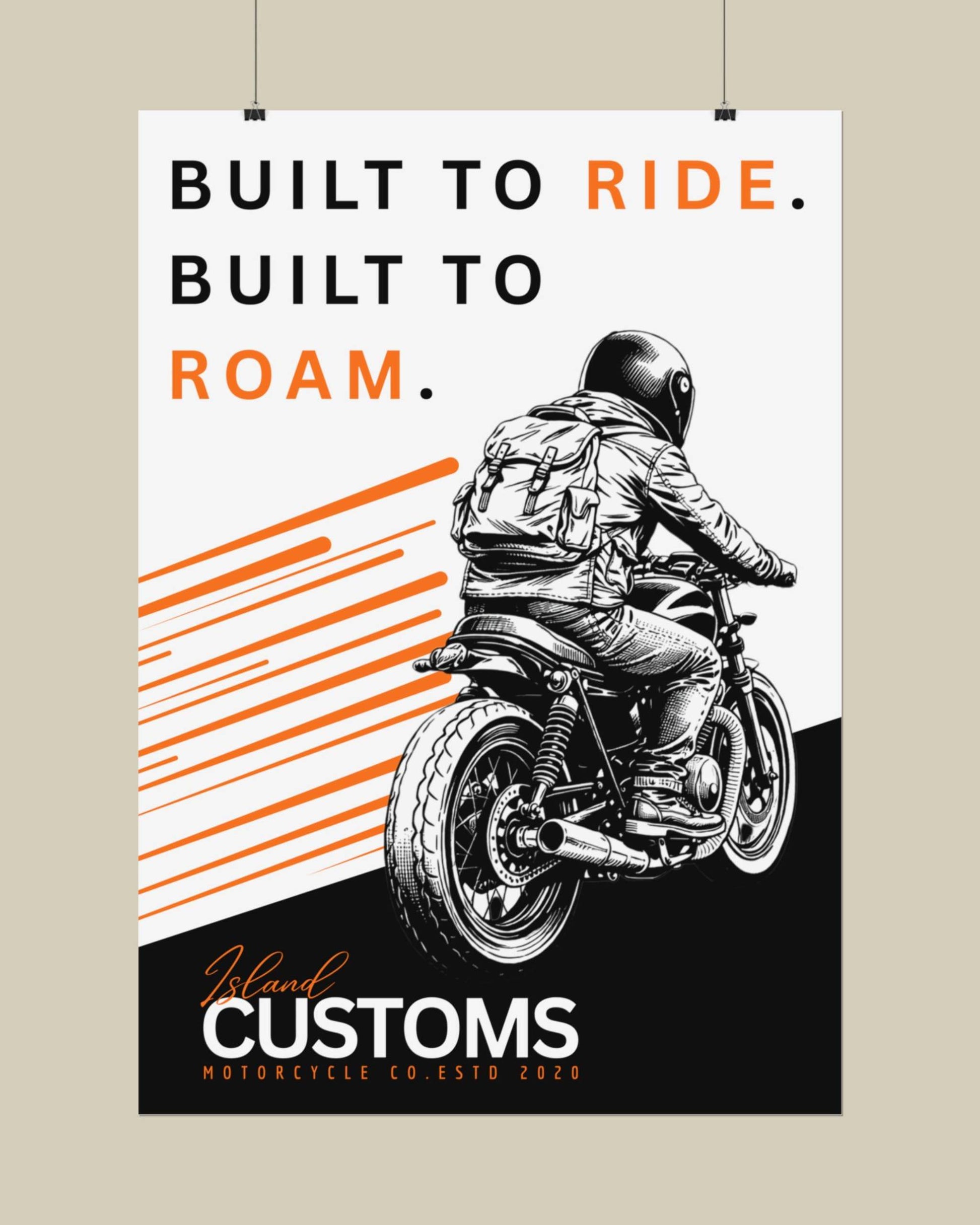 Poster with a motorcycle rider and text 'Built to Ride, Built to Roam' on a beige wall.