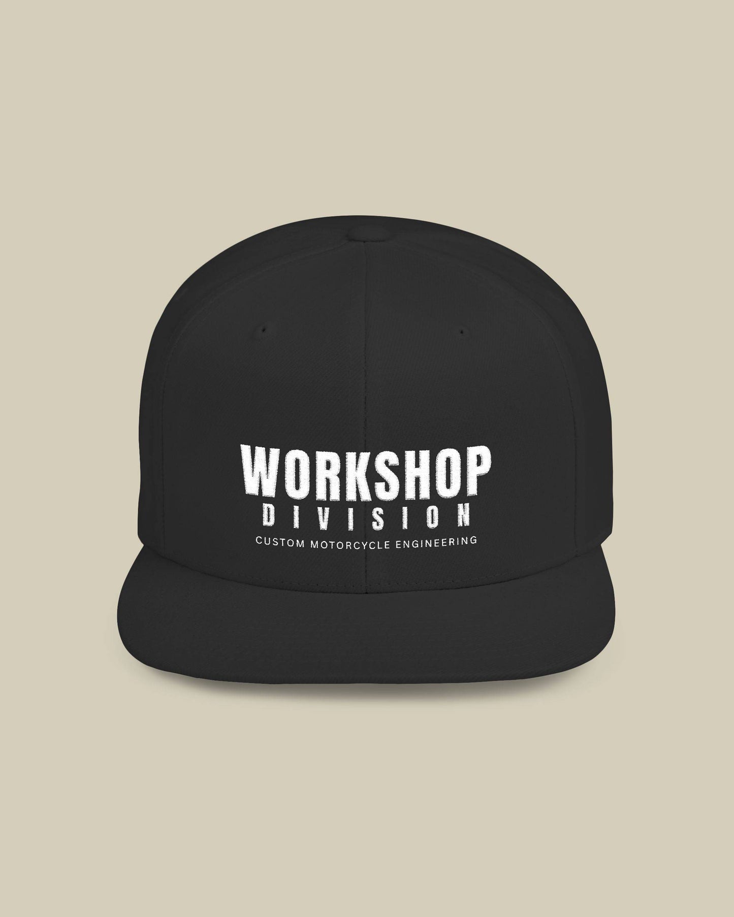 Black cap with 'WORKSHOP DIVISION' text on a beige background