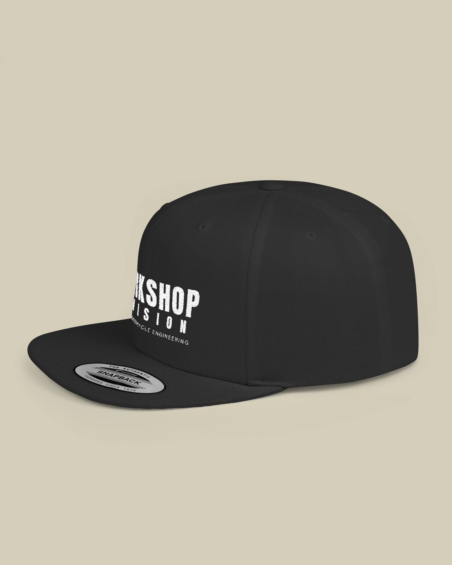 Black cap with white text on a beige background