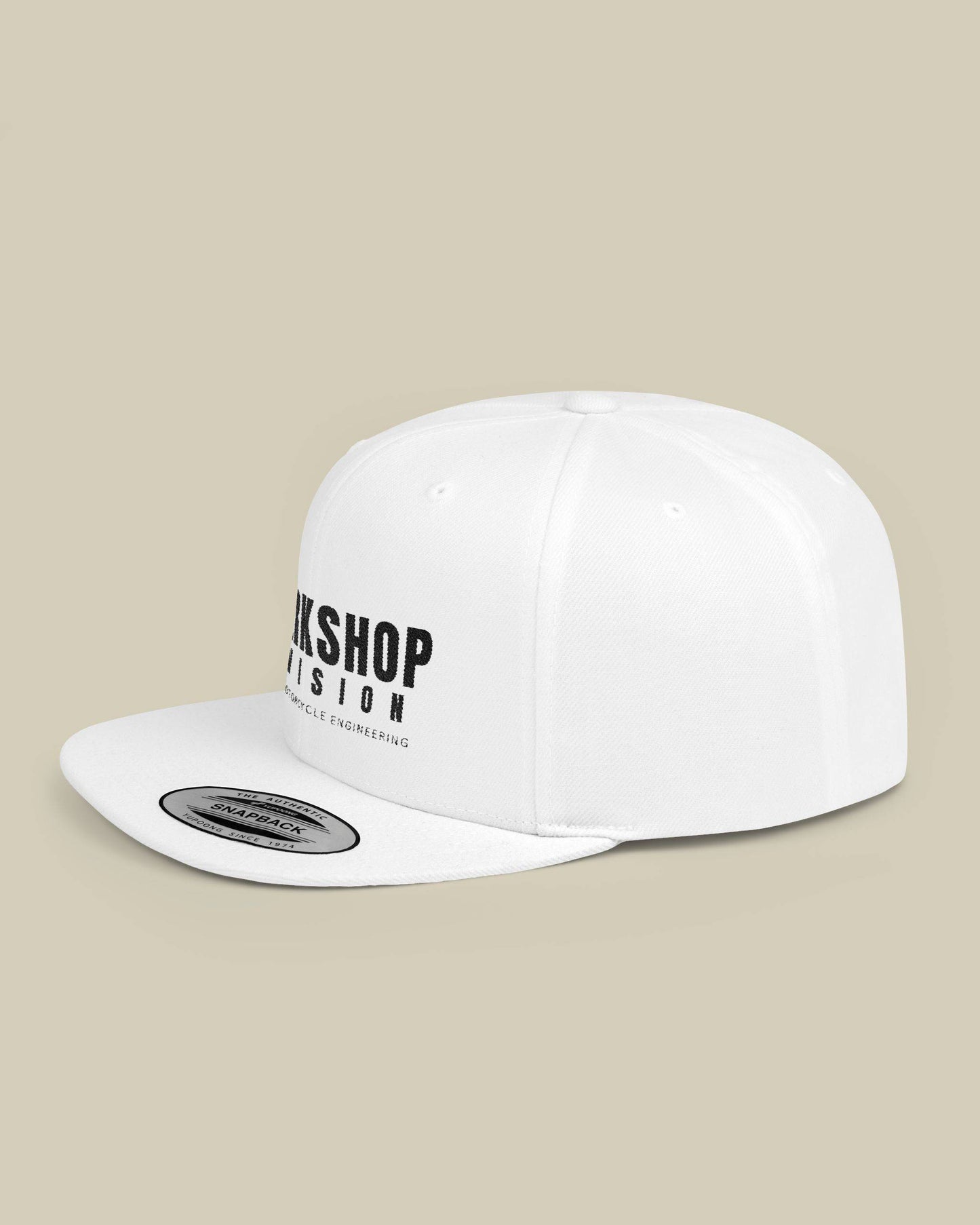 White cap with black text on a beige background
