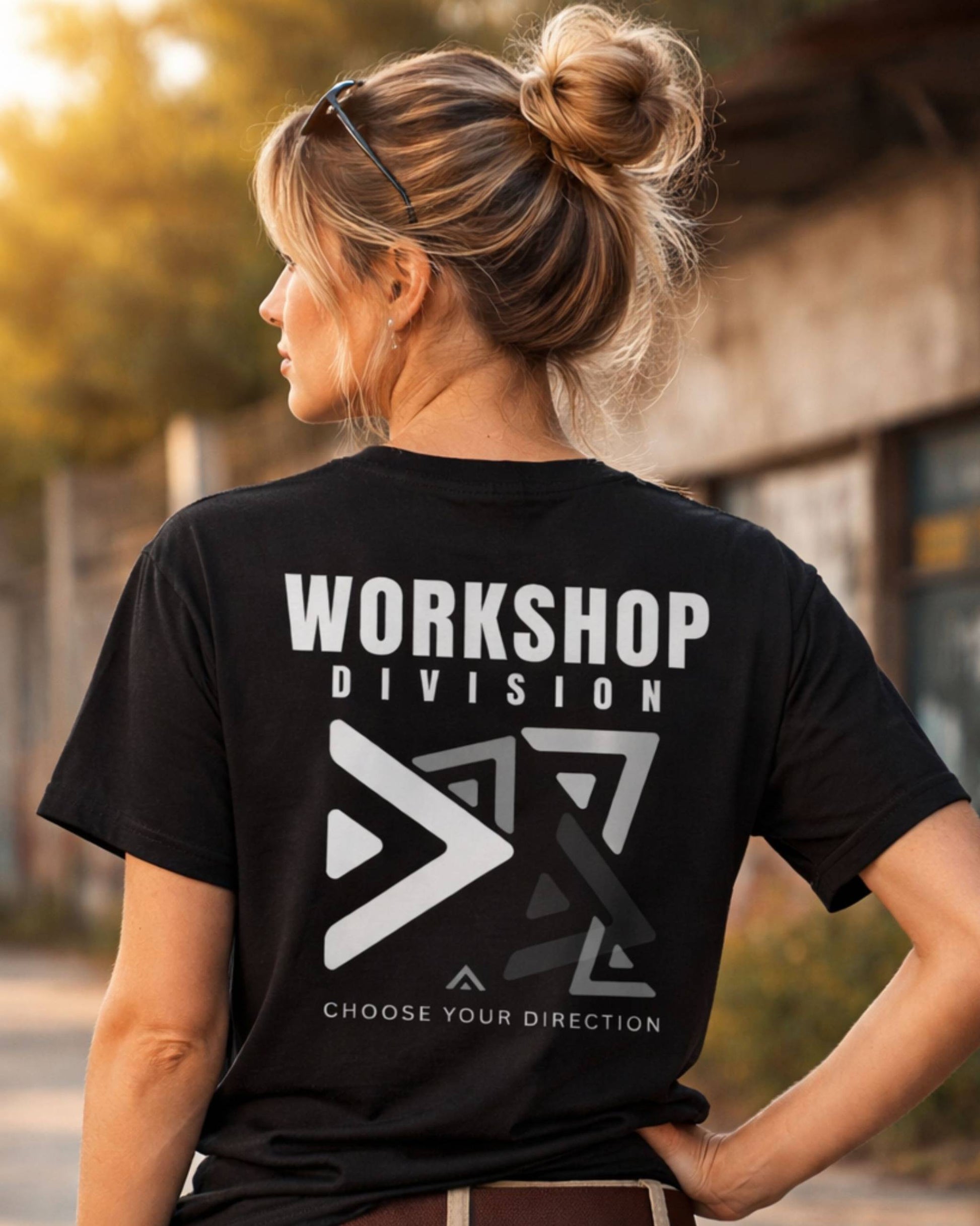 Person wearing a black t-shirt with 'Workshop Division' logo and text.